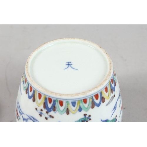 239 - A CHINESE DOUCAI PORCELAIN POT AND COVER, 10cm high.