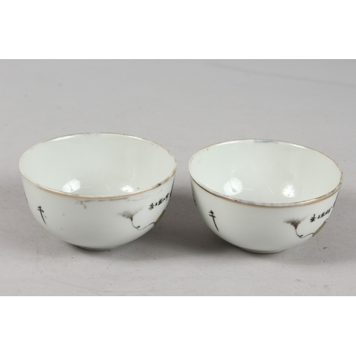 241 - A PAIR OF PORCELAIN TEACUPS.