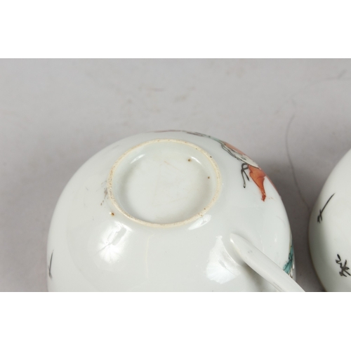 241 - A PAIR OF PORCELAIN TEACUPS.