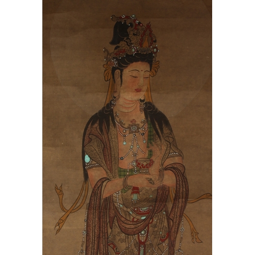 245 - A CHINESE SCROLL PAINTING ON PAPER, depicting Guanyin stood upon a lotus.