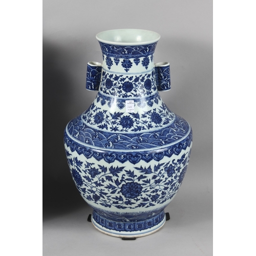 248 - A VERY LARGE PAIR OF CHINESE BLUE AND WHITE PORCELAIN TWIN HANDLE FLORAL VASES, each with character ... 