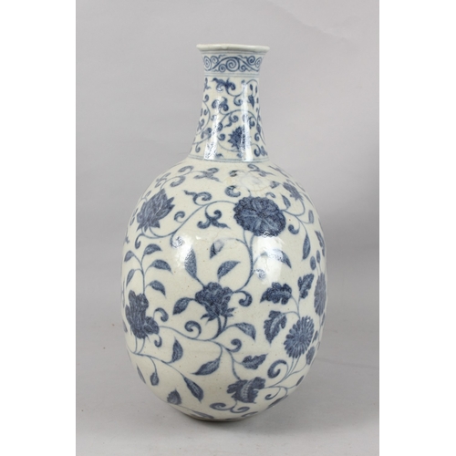 249 - A VERY LARGE CHINESE BLUE AND WHITE PORCELAIN FLORAL MOON FLASK VASE, 43cm high.