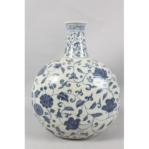 249 - A VERY LARGE CHINESE BLUE AND WHITE PORCELAIN FLORAL MOON FLASK VASE, 43cm high.