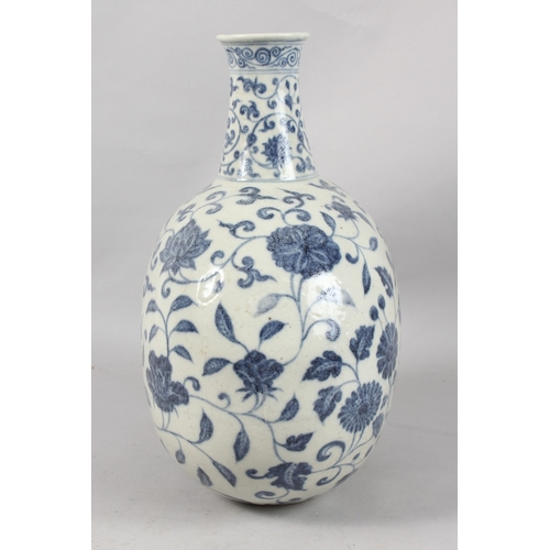 249 - A VERY LARGE CHINESE BLUE AND WHITE PORCELAIN FLORAL MOON FLASK VASE, 43cm high.