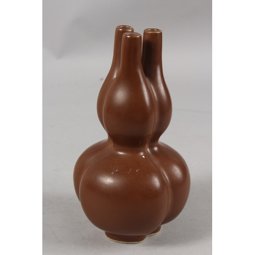 251 - A CHINESE CHESTNUT-BROWN GLAZE PORCELAIN THREE-NECK TULIP VASE, character mark to base, 22cm high.