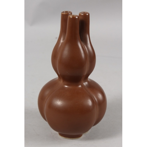 251 - A CHINESE CHESTNUT-BROWN GLAZE PORCELAIN THREE-NECK TULIP VASE, character mark to base, 22cm high.