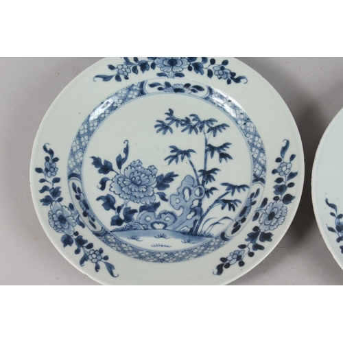 262 - A PAIR OF CHINESE BLUE AND WHITE PORCELAIN PLATES, with floral designs, 23cm diameter.