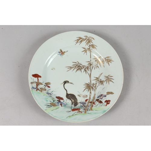 265 - A CHINESE QIANLONG PORCELAIN PLATE, painted with a crane and bamboo with mushroom heads, heightened ... 