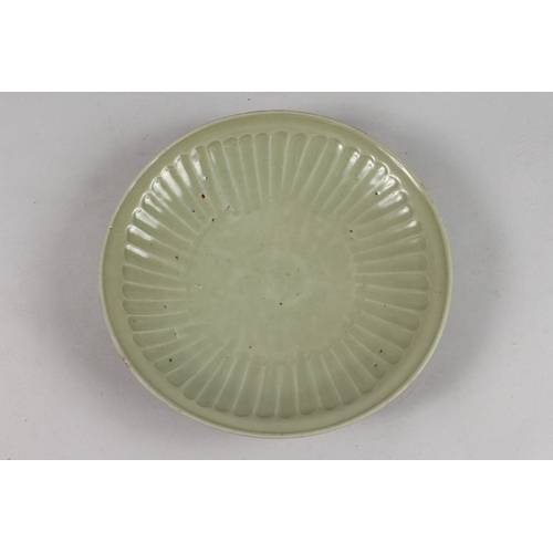 268 - A CHINESE MING SWATOW CELADON GLAZED FLUTED DISH, applied sticker to base 'collection of Walter Thom... 