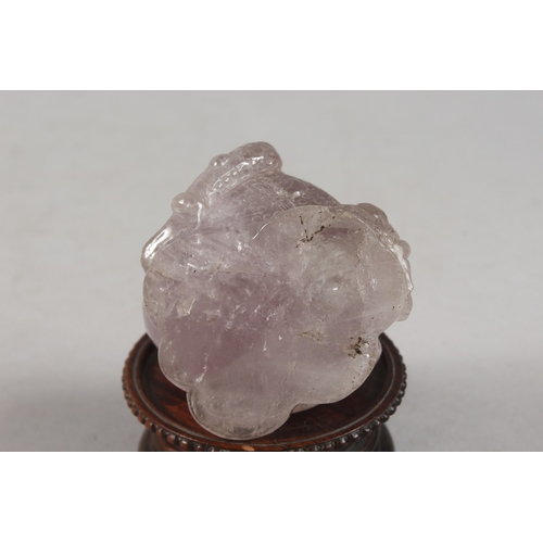 273 - A CHINESE CARVED ROSE QUARTZ TOAD ON HARDWOOD STAND, rose quartz 6.5cm high, 7cm long.