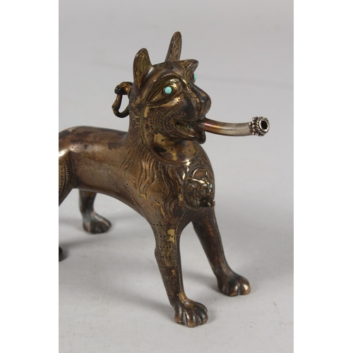 282 - A RARE EARLY ISLAMIC LION SHAPED AQUAMANILE POURING VESSEL, with turquoise inset eyes, 13cm high.