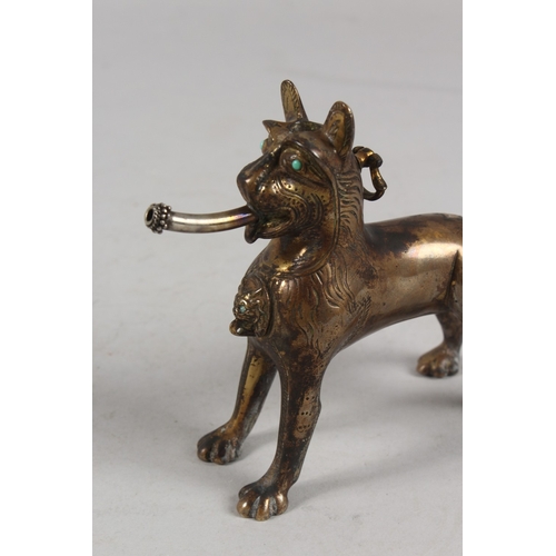 282 - A RARE EARLY ISLAMIC LION SHAPED AQUAMANILE POURING VESSEL, with turquoise inset eyes, 13cm high.