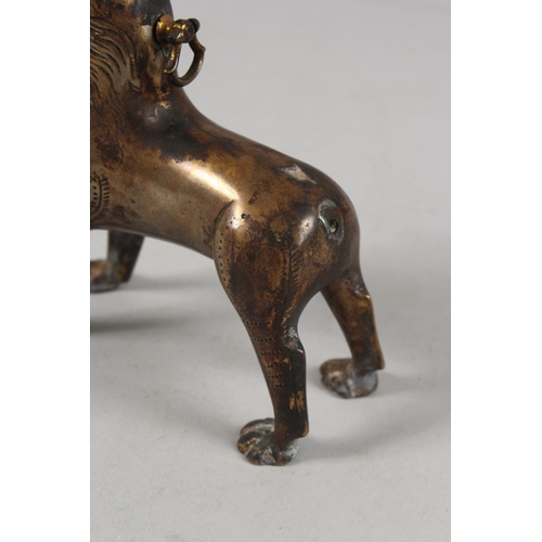 282 - A RARE EARLY ISLAMIC LION SHAPED AQUAMANILE POURING VESSEL, with turquoise inset eyes, 13cm high.