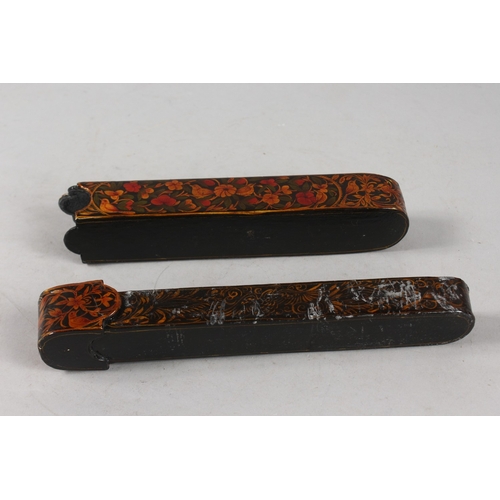 283 - A FINE PERSIAN QAJAR LACQUERED PAPIER MACHE PENBOX, 23cm long.