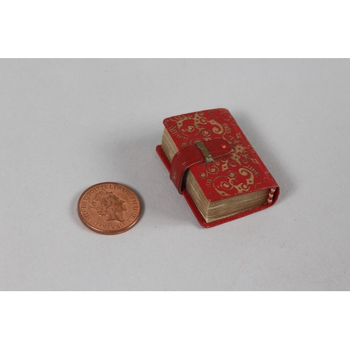 285 - A RARE 19TH-20TH CENTURY LEATHER BOUND MINIATURE QURAN, 3.8cm x 2.5cm.