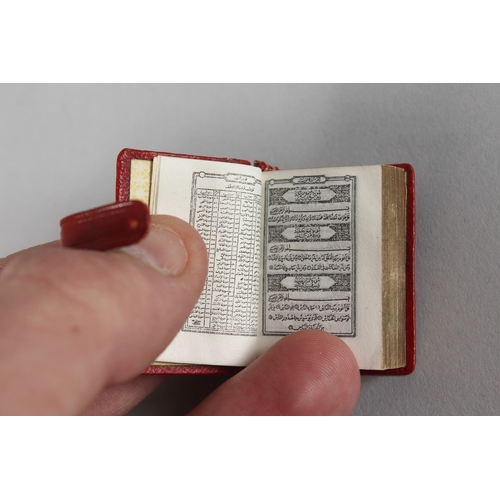 285 - A RARE 19TH-20TH CENTURY LEATHER BOUND MINIATURE QURAN, 3.8cm x 2.5cm.