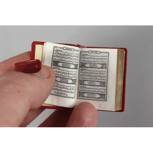 285 - A RARE 19TH-20TH CENTURY LEATHER BOUND MINIATURE QURAN, 3.8cm x 2.5cm.