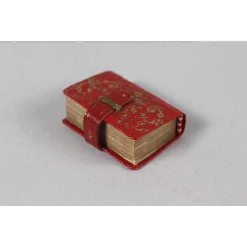 285 - A RARE 19TH-20TH CENTURY LEATHER BOUND MINIATURE QURAN, 3.8cm x 2.5cm.