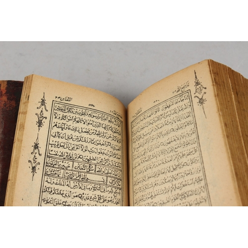 286 - A FINE 19TH CENTURY POSSIBLY PERSIAN LEATHER BOUND SMALL QURAN, signed and dated, 1308 HD / 1890 AD,... 