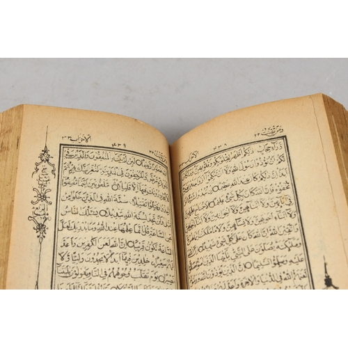 286 - A FINE 19TH CENTURY POSSIBLY PERSIAN LEATHER BOUND SMALL QURAN, signed and dated, 1308 HD / 1890 AD,... 