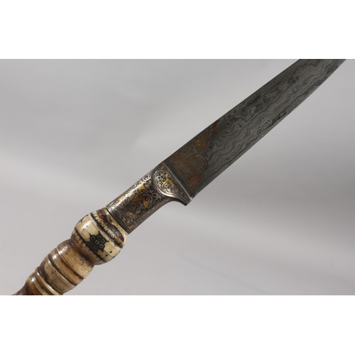 287 - A FINE INDIAN BONE HILTED SILVER AND GOLD INLAID WATERED STEEL DAGGER, 31cm long.