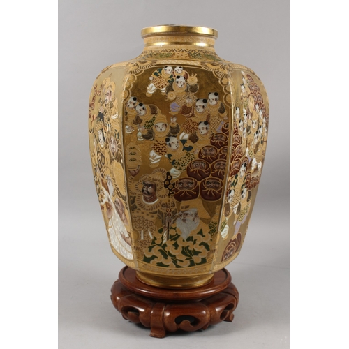 292 - A FINE AND LARGE JAPANESE KINKOZAN GILDED HEXAGONAL SATSUMA VASE ON HARDWOOD STAND, finely painted w... 