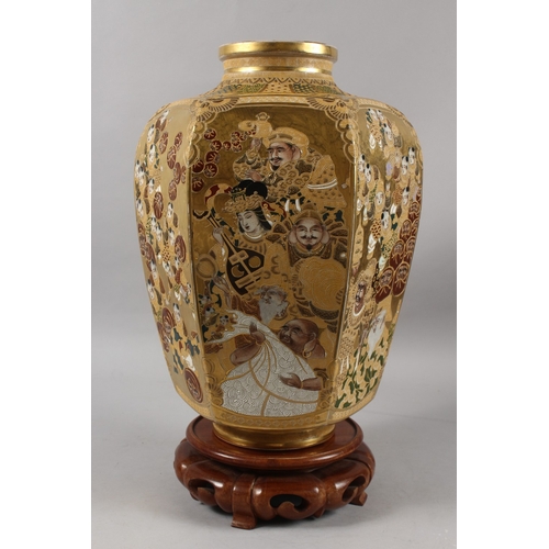 292 - A FINE AND LARGE JAPANESE KINKOZAN GILDED HEXAGONAL SATSUMA VASE ON HARDWOOD STAND, finely painted w... 