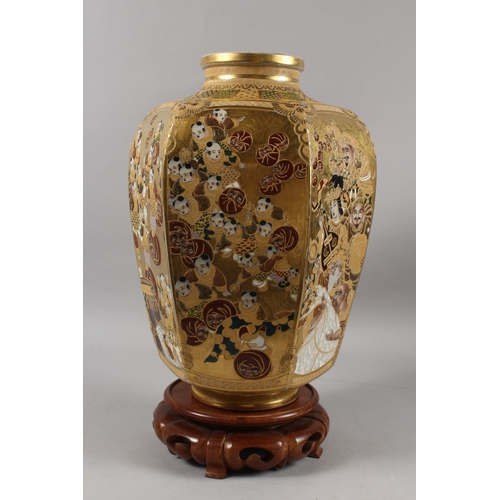 292 - A FINE AND LARGE JAPANESE KINKOZAN GILDED HEXAGONAL SATSUMA VASE ON HARDWOOD STAND, finely painted w... 