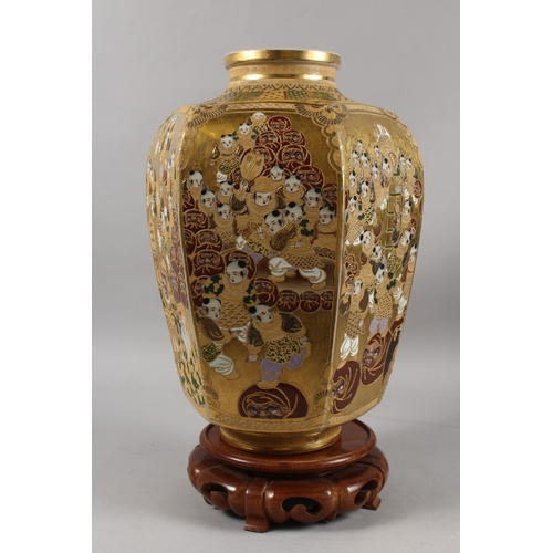 292 - A FINE AND LARGE JAPANESE KINKOZAN GILDED HEXAGONAL SATSUMA VASE ON HARDWOOD STAND, finely painted w... 