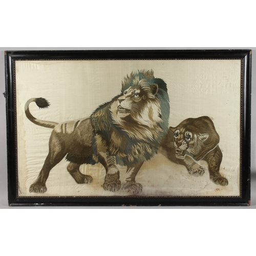 293 - A FINE AND LARGE JAPANESE EMBROIDERED SILK TEXTILE PICTURE OF A LION AND LIONESS, framed and glazed,... 