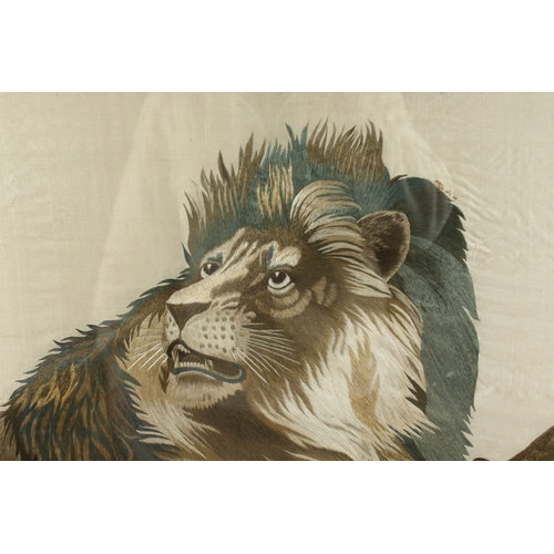 293 - A FINE AND LARGE JAPANESE EMBROIDERED SILK TEXTILE PICTURE OF A LION AND LIONESS, framed and glazed,... 