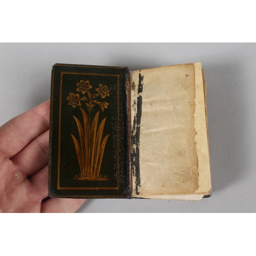 294 - A VERY FINE 19TH CENTURY PERSIAN QAJAR POCKET QURAN, with finely lacquered floral cover, the interio... 