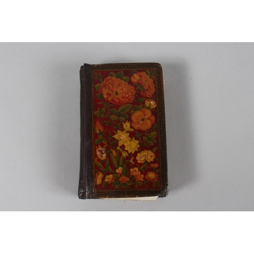 294 - A VERY FINE 19TH CENTURY PERSIAN QAJAR POCKET QURAN, with finely lacquered floral cover, the interio... 