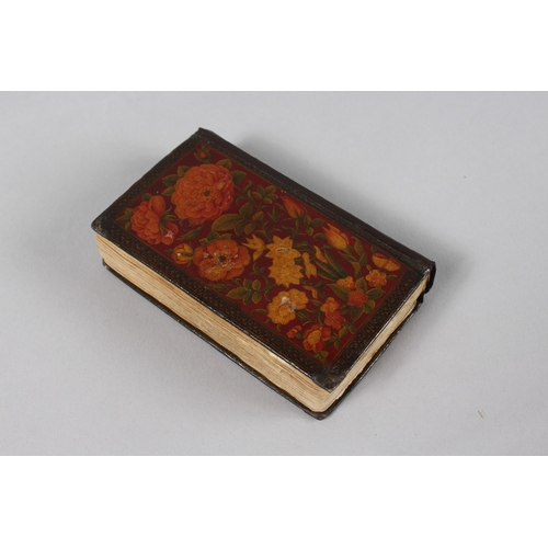 294 - A VERY FINE 19TH CENTURY PERSIAN QAJAR POCKET QURAN, with finely lacquered floral cover, the interio... 