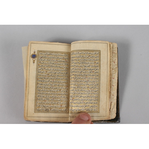 294 - A VERY FINE 19TH CENTURY PERSIAN QAJAR POCKET QURAN, with finely lacquered floral cover, the interio... 