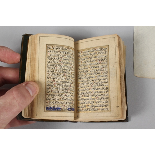 294 - A VERY FINE 19TH CENTURY PERSIAN QAJAR POCKET QURAN, with finely lacquered floral cover, the interio... 