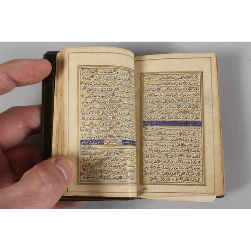 294 - A VERY FINE 19TH CENTURY PERSIAN QAJAR POCKET QURAN, with finely lacquered floral cover, the interio... 