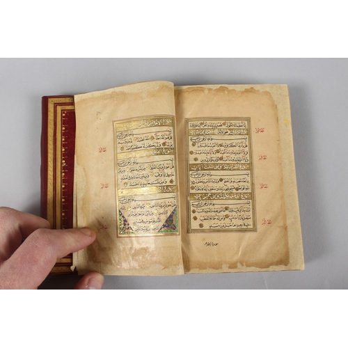 295 - A VERY FINE SMALL OTTOMAN TURKISH LEATHER BOUND QURAN, with exceptional gilded and illuminated pages... 