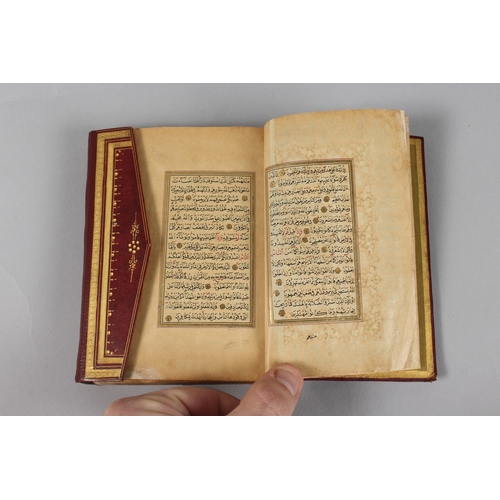 295 - A VERY FINE SMALL OTTOMAN TURKISH LEATHER BOUND QURAN, with exceptional gilded and illuminated pages... 