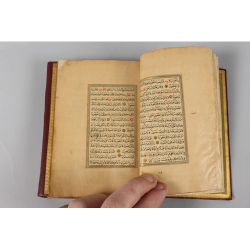 295 - A VERY FINE SMALL OTTOMAN TURKISH LEATHER BOUND QURAN, with exceptional gilded and illuminated pages... 