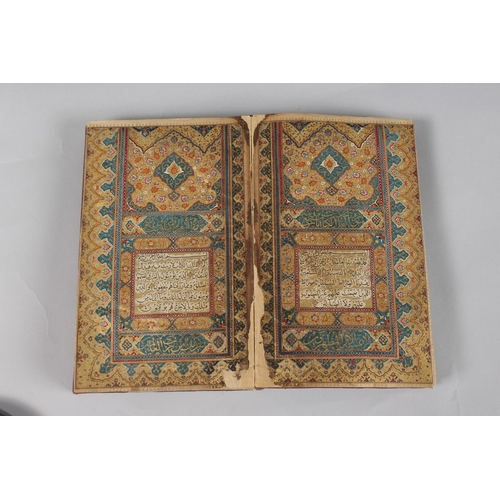 296 - A FINE PERSIAN QAJAR LEATHER BOUND QURAN, with embossed cover and finely gilded illuminated pages, d... 