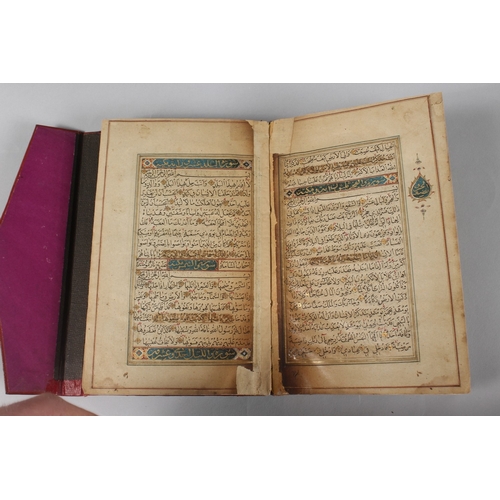 296 - A FINE PERSIAN QAJAR LEATHER BOUND QURAN, with embossed cover and finely gilded illuminated pages, d... 