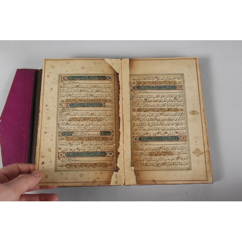 296 - A FINE PERSIAN QAJAR LEATHER BOUND QURAN, with embossed cover and finely gilded illuminated pages, d... 