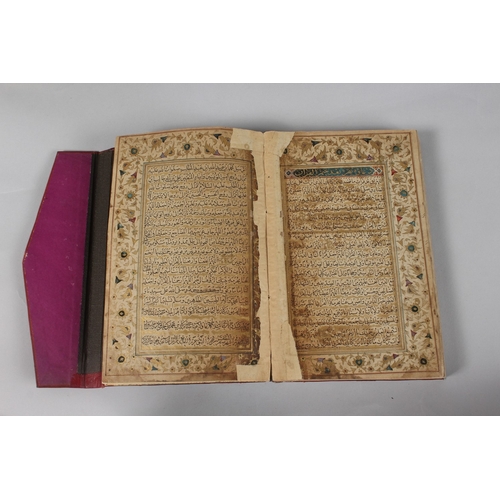 296 - A FINE PERSIAN QAJAR LEATHER BOUND QURAN, with embossed cover and finely gilded illuminated pages, d... 