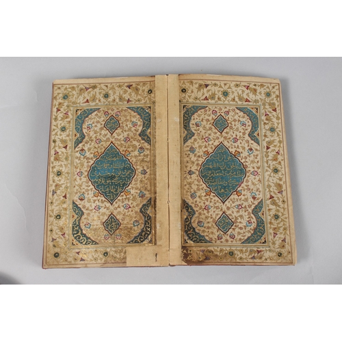 296 - A FINE PERSIAN QAJAR LEATHER BOUND QURAN, with embossed cover and finely gilded illuminated pages, d... 