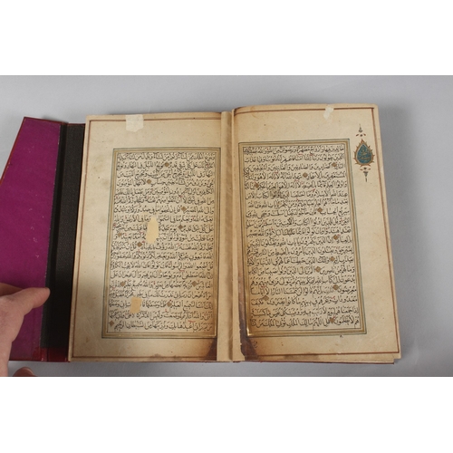 296 - A FINE PERSIAN QAJAR LEATHER BOUND QURAN, with embossed cover and finely gilded illuminated pages, d... 