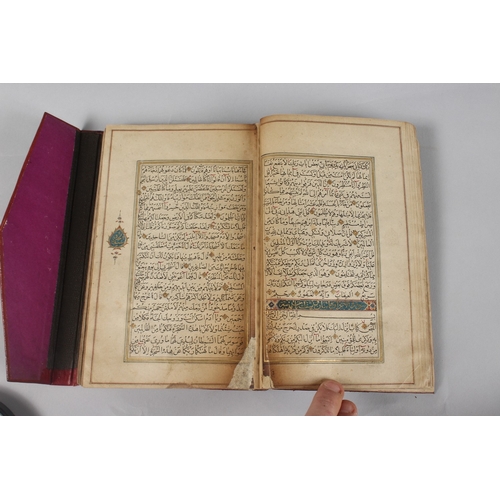 296 - A FINE PERSIAN QAJAR LEATHER BOUND QURAN, with embossed cover and finely gilded illuminated pages, d... 