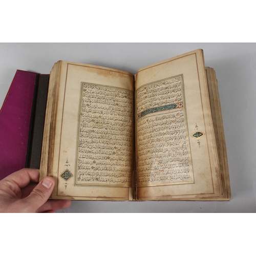 296 - A FINE PERSIAN QAJAR LEATHER BOUND QURAN, with embossed cover and finely gilded illuminated pages, d... 