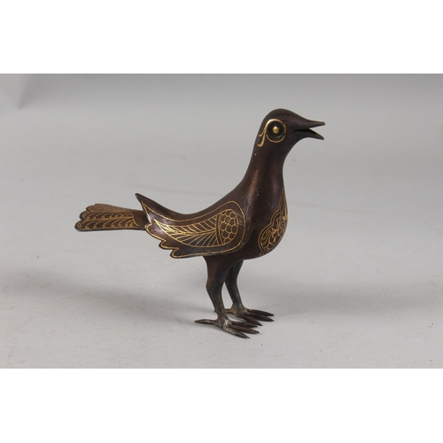 299 - A PERSIAN QAJAR GOLD INLAID STEEL BIRD, 15.5cm high.