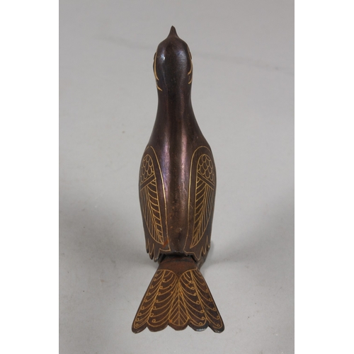 299 - A PERSIAN QAJAR GOLD INLAID STEEL BIRD, 15.5cm high.